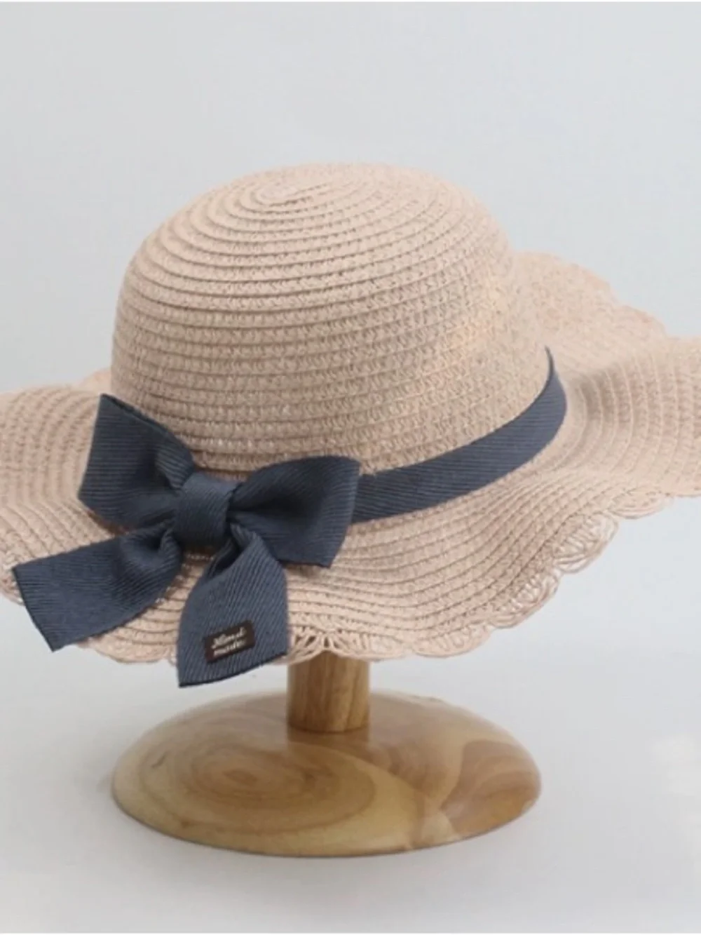Beige Straw Sun Hat with Navy Bow
